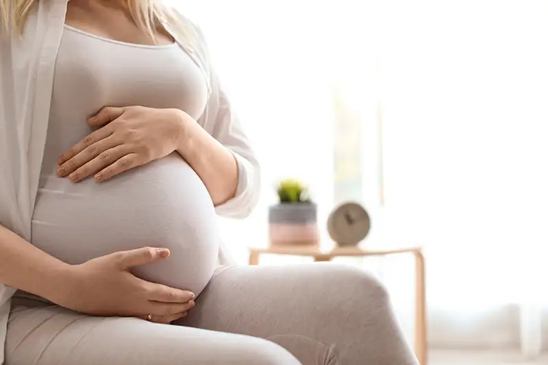 Pregnant surrogate during a VIP surrogacy journey with additional coordination for intended parents