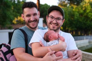 LGBTQ+ intended parents with their baby after using a surrogate in Beverly Hills, California